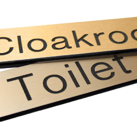 Engraved Sign with adhesive backing - 35x70mm dia Black text on brass effect