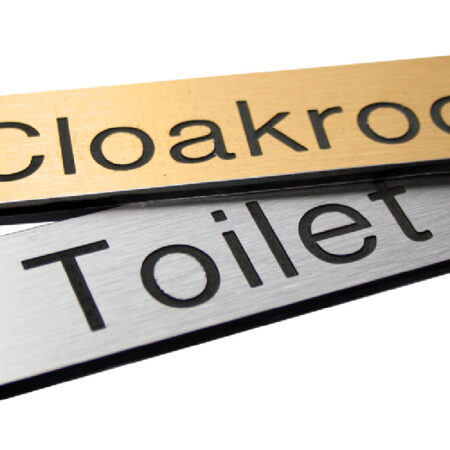 Engraved Sign with adhesive backing - 300x100mm dia Black text on brass effect