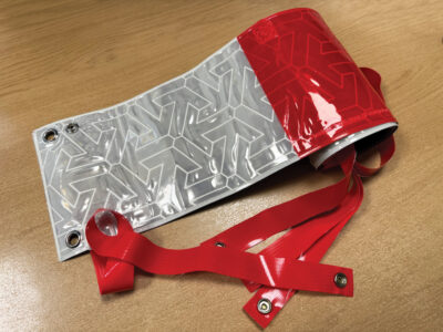 Reflective Fence Panel RA2 prismatic with eyelets & elastic straps (2 metres roll x 150mm width)