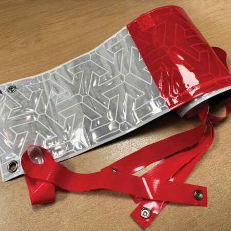 Reflective Fence Panel RA2 prismatic with eyelets & elastic straps (2 metres roll x 150mm width)