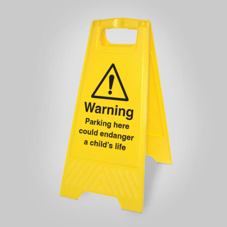 Parking here could endanger a child's life (free-standing yellow floor sign)